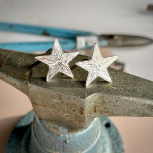 A pair of silver star shapped stud earrings