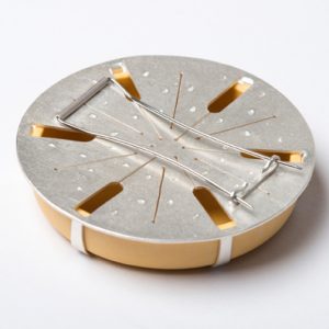 The back of a brooch showing the pin and clast