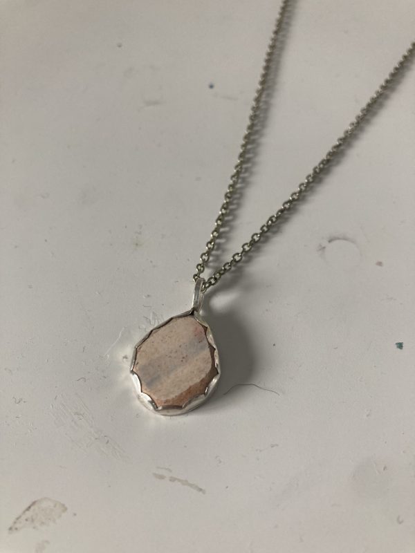 Pendant on necklace made using bezel stone setting